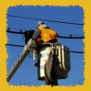 Utility worker fixing power lines